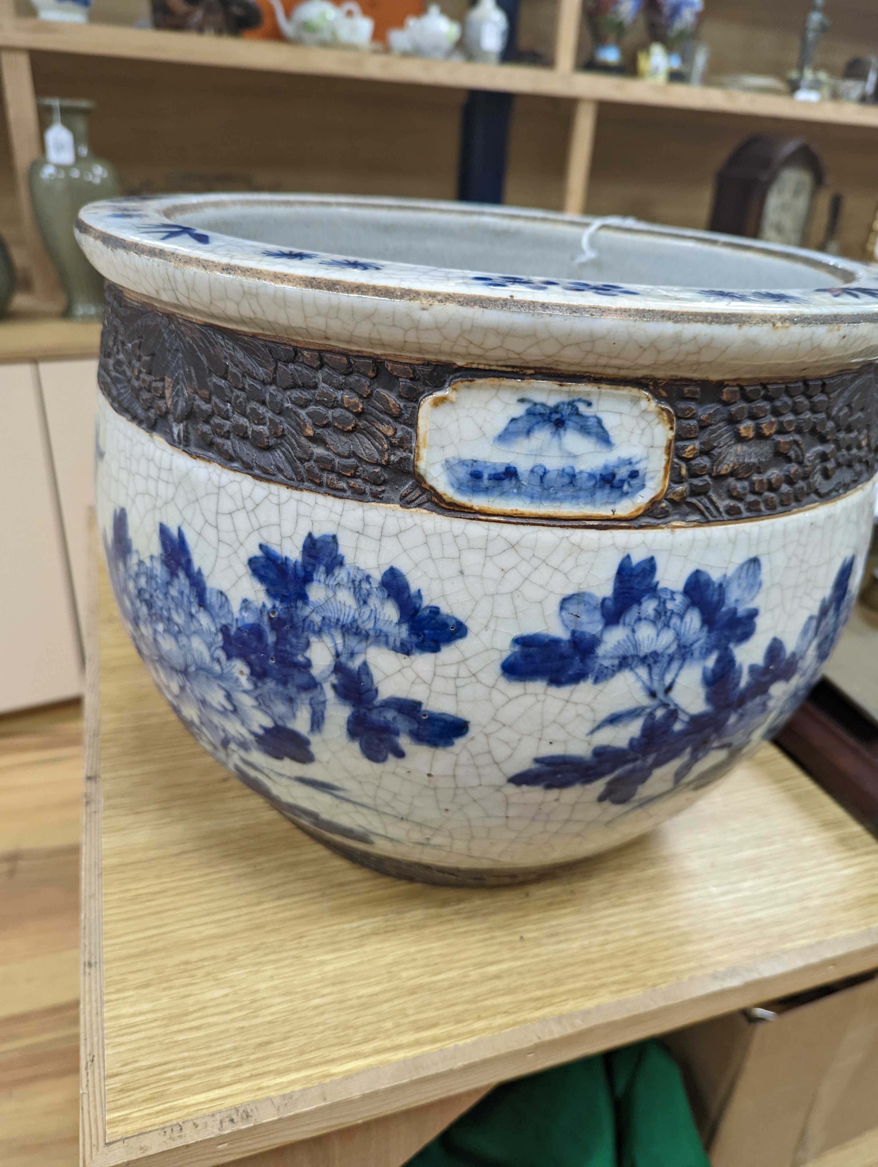 A late 19th/early 20th century Chinese blue and white crackleglaze jardiniere 30cm